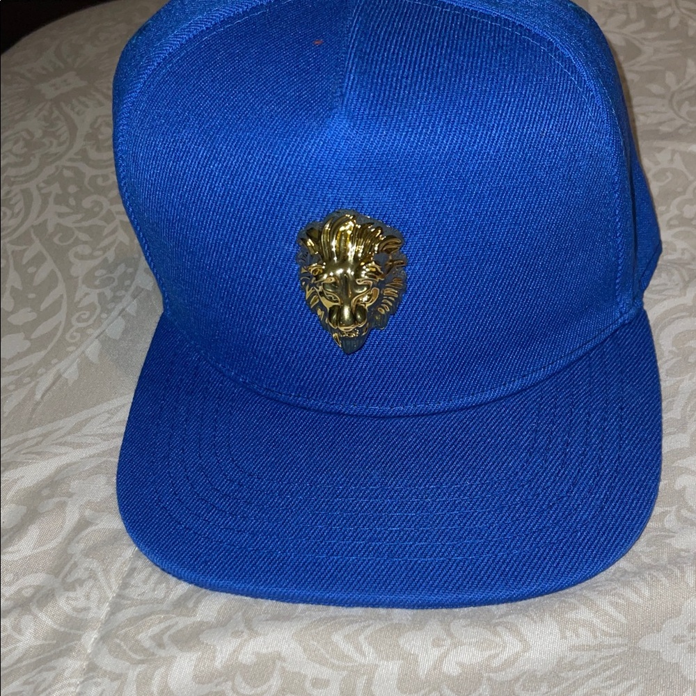 Blue Cap with Gold Lion Emblem